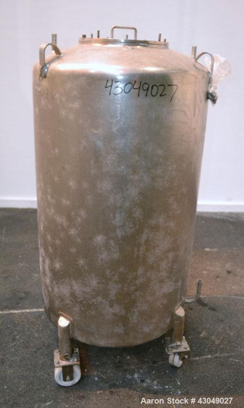 Used DCI Pressure Tank, 150 Gallon, 316L Stainless Steel, Vertical. 30’’ Diameter x 44’’ straight side, dished top and bottom. Internal rated 25 psi at 200 degrees F. Openings: top 12’’ manway with c...
