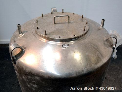 Used DCI Pressure Tank, 150 Gallon, 316L Stainless Steel, Vertical. 30’’ Diameter x 44’’ straight side, dished top and bottom. Internal rated 25 psi at 200 degrees F. Openings: top 12’’ manway with c...