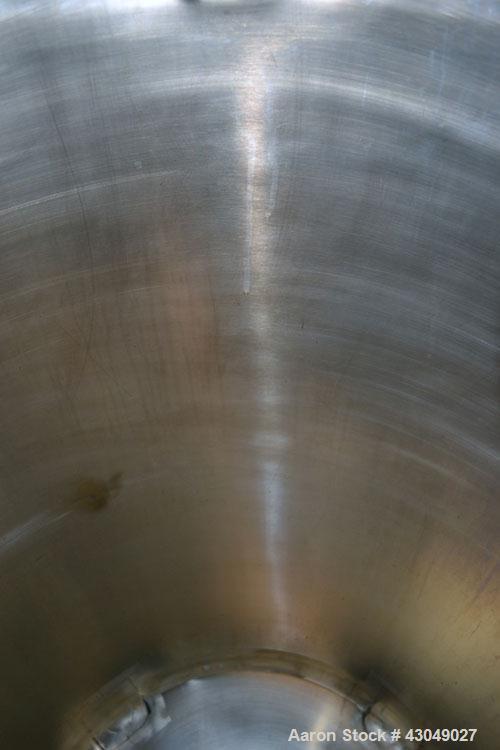 Used DCI Pressure Tank, 150 Gallon, 316L Stainless Steel, Vertical. 30’’ Diameter x 44’’ straight side, dished top and bottom. Internal rated 25 psi at 200 degrees F. Openings: top 12’’ manway with c...