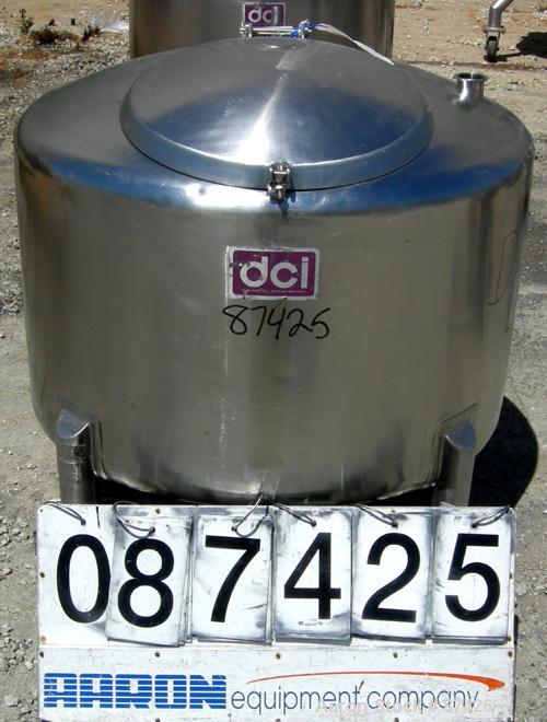 USED: DCI tank, 100 gallon, 316 stainless steel, vertical. 38" diameter x 20" straight side, dish top, inverted dished sloped bottom. Openings: top 2" tri clamp, 18" manway with cover; 2" side bottom...