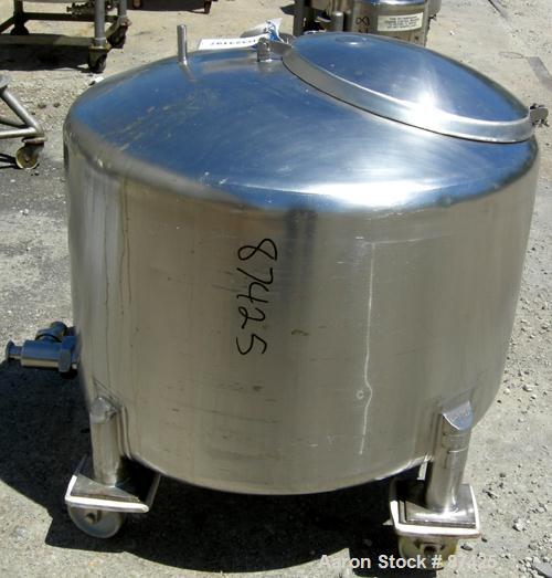 USED: DCI tank, 100 gallon, 316 stainless steel, vertical. 38" diameter x 20" straight side, dish top, inverted dished sloped bottom. Openings: top 2" tri clamp, 18" manway with cover; 2" side bottom...