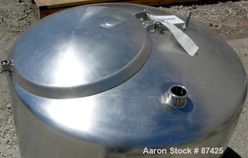 USED: DCI tank, 100 gallon, 316 stainless steel, vertical. 38" diameter x 20" straight side, dish top, inverted dished sloped bottom. Openings: top 2" tri clamp, 18" manway with cover; 2" side bottom...