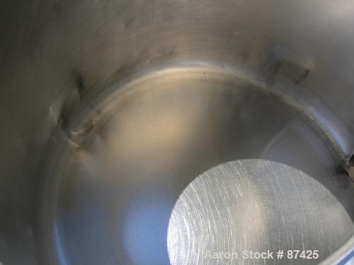 USED: DCI tank, 100 gallon, 316 stainless steel, vertical. 38" diameter x 20" straight side, dish top, inverted dished sloped bottom. Openings: top 2" tri clamp, 18" manway with cover; 2" side bottom...