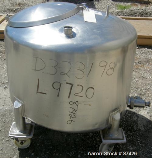 USED: DCI tank, 100 gallon, 316 stainless steel, vertical. 38" diameter x 20" straight side, dish top, inverted dished sloped bottom. Openings: top 2" tri clamp, 18" manway with cover; 2" side bottom...