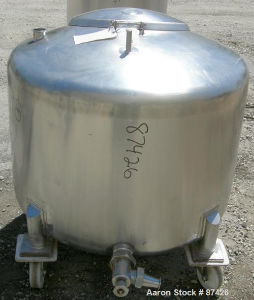USED: DCI tank, 100 gallon, 316 stainless steel, vertical. 38" diameter x 20" straight side, dish top, inverted dished sloped bottom. Openings: top 2" tri clamp, 18" manway with cover; 2" side bottom...