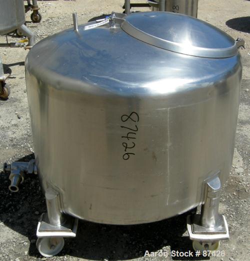 USED: DCI tank, 100 gallon, 316 stainless steel, vertical. 38" diameter x 20" straight side, dish top, inverted dished sloped bottom. Openings: top 2" tri clamp, 18" manway with cover; 2" side bottom...