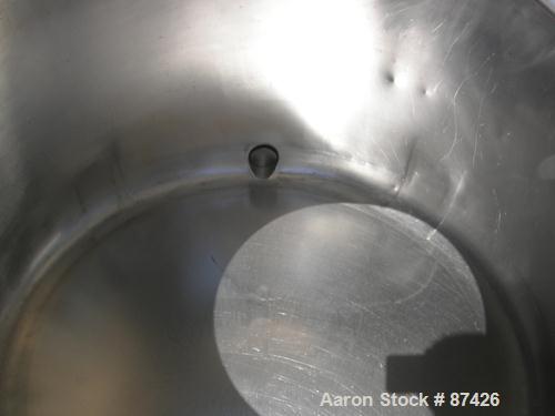 USED: DCI tank, 100 gallon, 316 stainless steel, vertical. 38" diameter x 20" straight side, dish top, inverted dished sloped bottom. Openings: top 2" tri clamp, 18" manway with cover; 2" side bottom...
