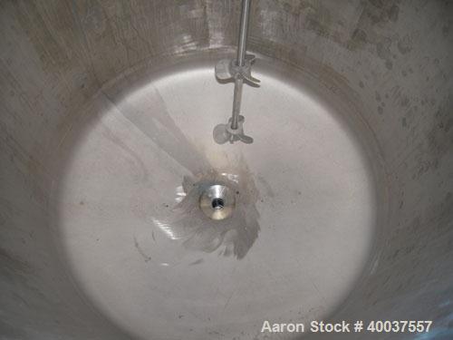 Used Douglas Brothers Tank, 40 gallon, stainless steel, vertical. 24'' diameter x 18'' straight side. Open top with a 1/2 hinged cover, dished bottom. Clamp on Lightnin air operated agitator, model N...