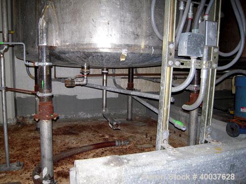 Used Ertel Tank, 580 Gallon, Stainless steel, Vertical. 53" diameter x 60" straight side, flat top, slight dished bottom. Openings top 17" manway, 2" NPT center bottom outlet. Mounted on 4 carbon ste...