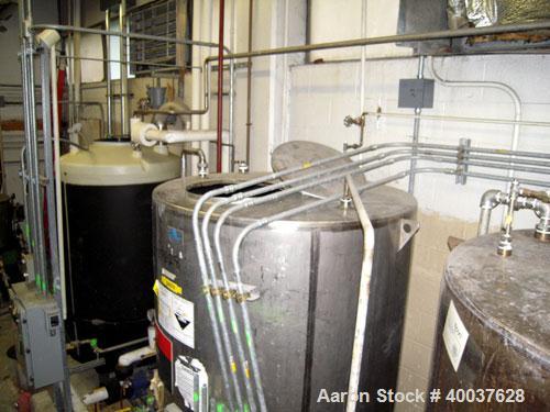 Used Ertel Tank, 580 Gallon, Stainless steel, Vertical. 53" diameter x 60" straight side, flat top, slight dished bottom. Openings top 17" manway, 2" NPT center bottom outlet. Mounted on 4 carbon ste...