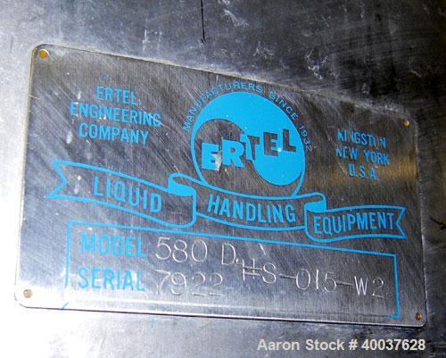 Used Ertel Tank, 580 Gallon, Stainless steel, Vertical. 53" diameter x 60" straight side, flat top, slight dished bottom. Openings top 17" manway, 2" NPT center bottom outlet. Mounted on 4 carbon ste...