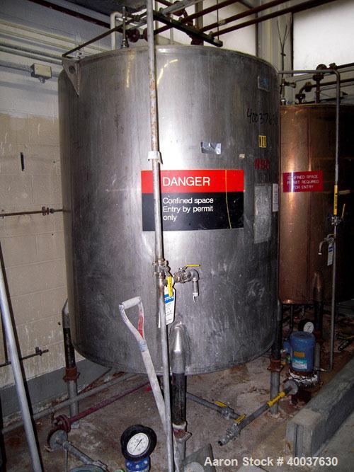 Used Ertel Tank, 580 Gallon, Stainless steel, Vertical. 53" diameter x 60" straight side, flat top, slight dished bottom. Openings top 17" manway, 2" NPT center bottom outlet. Mounted on 4 carbon ste...