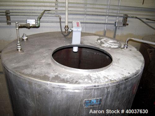 Used Ertel Tank, 580 Gallon, Stainless steel, Vertical. 53" diameter x 60" straight side, flat top, slight dished bottom. Openings top 17" manway, 2" NPT center bottom outlet. Mounted on 4 carbon ste...