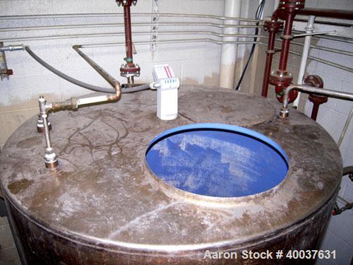 Used Ertel Tank, 580 Gallon, Stainless steel, Vertical. 53" diameter x 60" straight side, flat top, slight dished bottom. Openings top 17" manway, 2" NPT center bottom outlet. Mounted on 4 carbon ste...