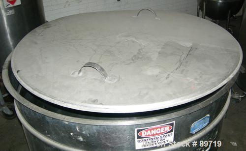 USED: Filpaco tank, 225 gallon, 304 stainless steel, vertical. 38" diameter x 48" straight side, open top with cover, slight coned bottom. Approximate 1" center bottom outlet. Mounted on 4 carbon ste...