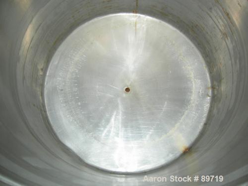 USED: Filpaco tank, 225 gallon, 304 stainless steel, vertical. 38" diameter x 48" straight side, open top with cover, slight coned bottom. Approximate 1" center bottom outlet. Mounted on 4 carbon ste...