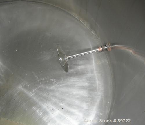 USED: Filpaco tank, 425 gallon, 304 stainless steel, vertical. 52" diameter x 47" straight side, open top with a 2 piece cover, sloped bottom. 1-1/2" off center bottom outlet. Side bottom 3 blade agi...