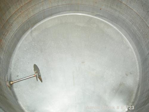 USED: Filpaco tank, 425 gallon, 304 stainless steel, vertical. 52" diameter x 47" straight side, open top with a 2 piece cover, sloped bottom. 1-1/2" off center bottom outlet. Side bottom 3 blade agi...