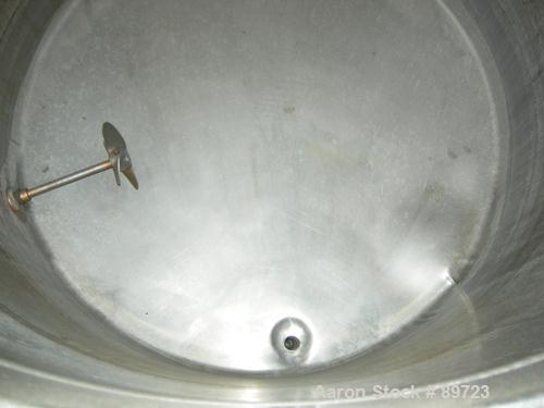 USED: Filpaco tank, 425 gallon, 304 stainless steel, vertical. 52" diameter x 47" straight side, open top with a 2 piece cover, sloped bottom. 1-1/2" off center bottom outlet. Side bottom 3 blade agi...