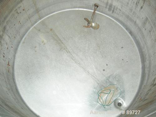 USED: Filpaco tank, 425 gallon, 304 stainless steel, vertical. 52" diameter x 47" straight side, open top with a 2 piece cover, sloped bottom. 1-1/2" off center bottom outlet. Side bottom 3 blade agi...