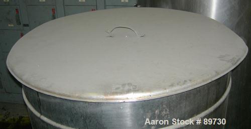 USED: Filpaco tank, 225 gallon, 304 stainless steel, vertical. 38" diameter x 46" straight side, open top with cover, flat bottom. Approximate 1-1/2" off center bottom outlet. Side bottom 4 blade agi...