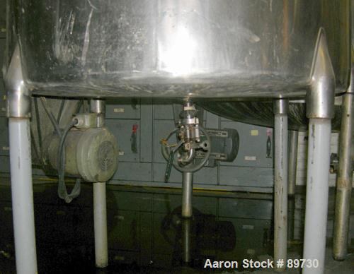 USED: Filpaco tank, 225 gallon, 304 stainless steel, vertical. 38" diameter x 46" straight side, open top with cover, flat bottom. Approximate 1-1/2" off center bottom outlet. Side bottom 4 blade agi...