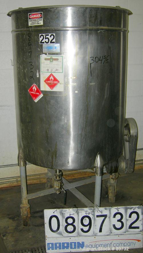 USED: Filpaco tank, 225 gallon, 304 stainless steel, vertical. 38" diameter x 46" straight side, open top with cover, flat bottom. Approximate 1-1/2" off center bottom outlet. Side bottom 3 blade agi...