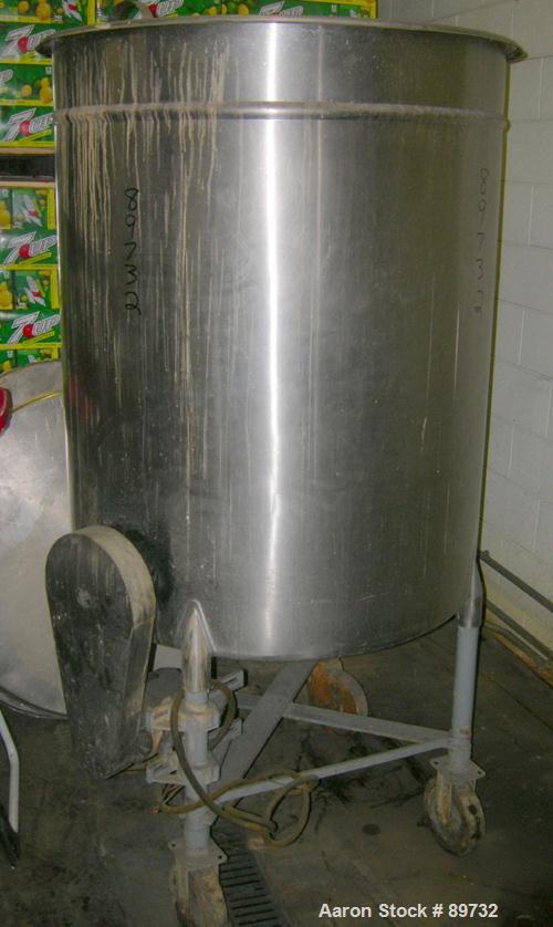 USED: Filpaco tank, 225 gallon, 304 stainless steel, vertical. 38" diameter x 46" straight side, open top with cover, flat bottom. Approximate 1-1/2" off center bottom outlet. Side bottom 3 blade agi...