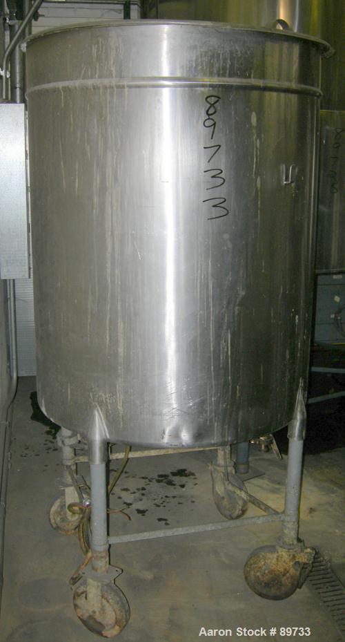 USED: Filpaco tank, 225 gallon, 304 stainless steel, vertical. 38" diameter x 46" straight side, open top with cover, flat bottom. Approximate 1-1/2" off center bottom outlet. Side bottom 3 blade agi...