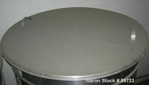 USED: Filpaco tank, 225 gallon, 304 stainless steel, vertical. 38" diameter x 46" straight side, open top with cover, flat bottom. Approximate 1-1/2" off center bottom outlet. Side bottom 3 blade agi...