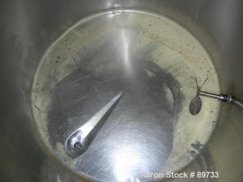 USED: Filpaco tank, 225 gallon, 304 stainless steel, vertical. 38" diameter x 46" straight side, open top with cover, flat bottom. Approximate 1-1/2" off center bottom outlet. Side bottom 3 blade agi...