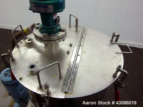 Used Graco Mixing System consisting of: (1) Graco tank, 45 gallon, 304 stainless steel. 24" Diameter x 21" straight side, open top with a 1/3 hinged clamp down cover, dished bottom. Approximate 1/2" ...