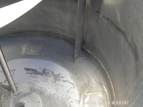 USED: Graco tank, 100 gallon, 304 stainless steel, vertical. 30" diameter x 20" straight side. Flat bolt on top with 1/4 hinged cover, dish bottom. Top entering air operated Lightnin agitator, model ...
