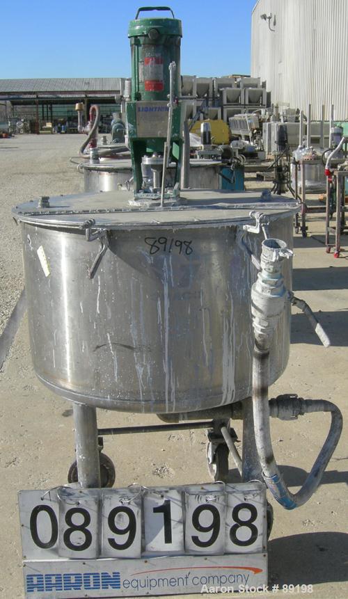 USED: Graco tank, 100 gallon, 304 stainless steel, vertical. 30" diameter x 20" straight side. Flat bolt on top with 1/4 hinged cover, dish bottom. Top entering Lightnin agitator, model XJCK-43. 1" d...