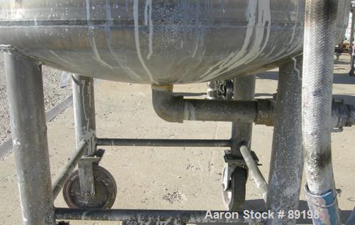 USED: Graco tank, 100 gallon, 304 stainless steel, vertical. 30" diameter x 20" straight side. Flat bolt on top with 1/4 hinged cover, dish bottom. Top entering Lightnin agitator, model XJCK-43. 1" d...