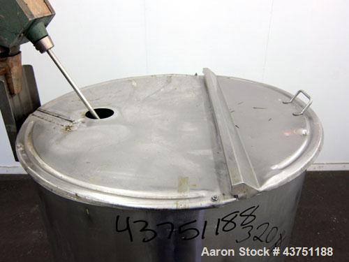 Used Groen Tank, 200 Gallon, 304 Stainless Steel, Vertical.  38" Diameter x 47" straight side.  Bolt-on hinged top cover, 1" sloped bottom.  Clamp-on Lightnin air operated agitator, model NAG-33.  3/...
