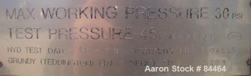 Used Grundy Pressure Tank, 182 gallon, 304 stainless steel, vertical. 38" diameter x 30" straight side, dished top and bottom, rated 30 psi. Openings: top 1-1/2", (2) 3" sight glass; side (3) 1", 14"...