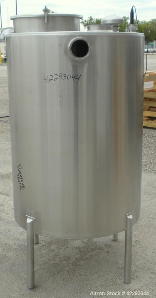 Used Hartel Tank, 200 Gallon, 304 Stainless Steel, Vertical. 36" Diameter x 48" straight side. Flat top and bottom. Openings: top 1-1/2" tri-clamp, 2" tri-clamp, 3" tri-clamp, 6" tri-clamp, 16" manwa...