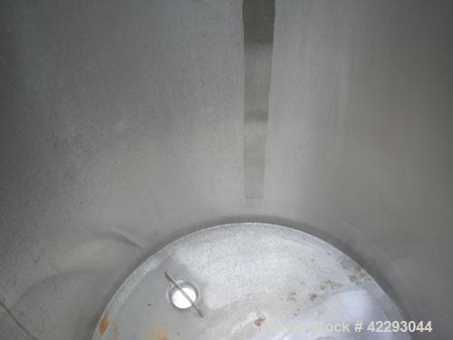 Used Hartel Tank, 200 Gallon, 304 Stainless Steel, Vertical. 36" Diameter x 48" straight side. Flat top and bottom. Openings: top 1-1/2" tri-clamp, 2" tri-clamp, 3" tri-clamp, 6" tri-clamp, 16" manwa...