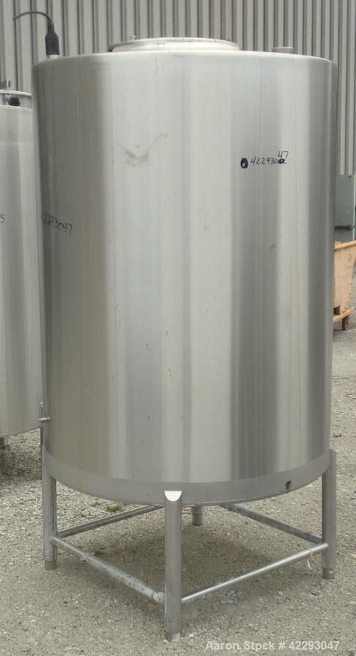 Used Hartel Tank, 400 Gallon, 304 Stainless Steel, Vertical. 45" Diameter x 60" straight side. Flat top and bottom. Openings: top (2) 2" tri-clamp, (2) 3-1/2" threaded, 4" tri-clamp, 18" manway with ...