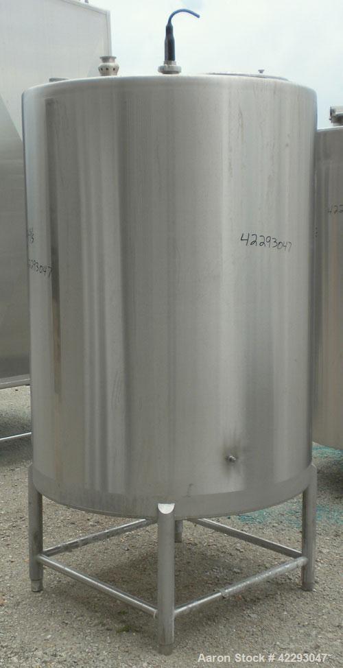 Used Hartel Tank, 400 Gallon, 304 Stainless Steel, Vertical. 45" Diameter x 60" straight side. Flat top and bottom. Openings: top (2) 2" tri-clamp, (2) 3-1/2" threaded, 4" tri-clamp, 18" manway with ...