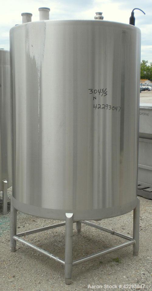 Used Hartel Tank, 400 Gallon, 304 Stainless Steel, Vertical. 45" Diameter x 60" straight side. Flat top and bottom. Openings: top (2) 2" tri-clamp, (2) 3-1/2" threaded, 4" tri-clamp, 18" manway with ...