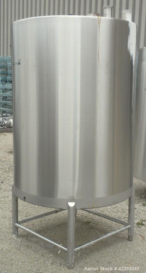 Used Hartel Tank, 400 Gallon, 304 Stainless Steel, Vertical. 45" Diameter x 60" straight side. Flat top and bottom. Openings: top (2) 2" tri-clamp, (2) 3-1/2" threaded, 4" tri-clamp, 18" manway with ...