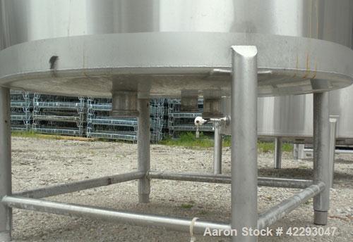Used Hartel Tank, 400 Gallon, 304 Stainless Steel, Vertical. 45" Diameter x 60" straight side. Flat top and bottom. Openings: top (2) 2" tri-clamp, (2) 3-1/2" threaded, 4" tri-clamp, 18" manway with ...