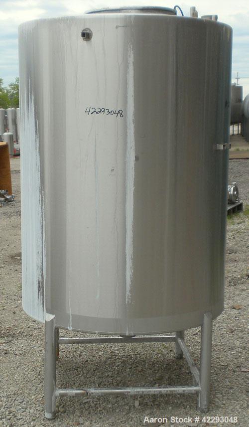 Used Hartel Tank, 400 Gallon, 304 Stainless Steel, Vertical. 45'' Diameter x 60'' straight side. Flat top and bottom. Openings: top 1-1/2'' tri-clamp, 2'' tri-clamp, (2) 3-1/2'' threaded, (2) 3/4'' N...