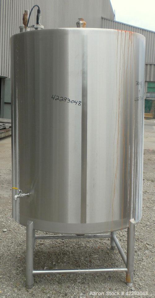 Used Hartel Tank, 400 Gallon, 304 Stainless Steel, Vertical. 45'' Diameter x 60'' straight side. Flat top and bottom. Openings: top 1-1/2'' tri-clamp, 2'' tri-clamp, (2) 3-1/2'' threaded, (2) 3/4'' N...