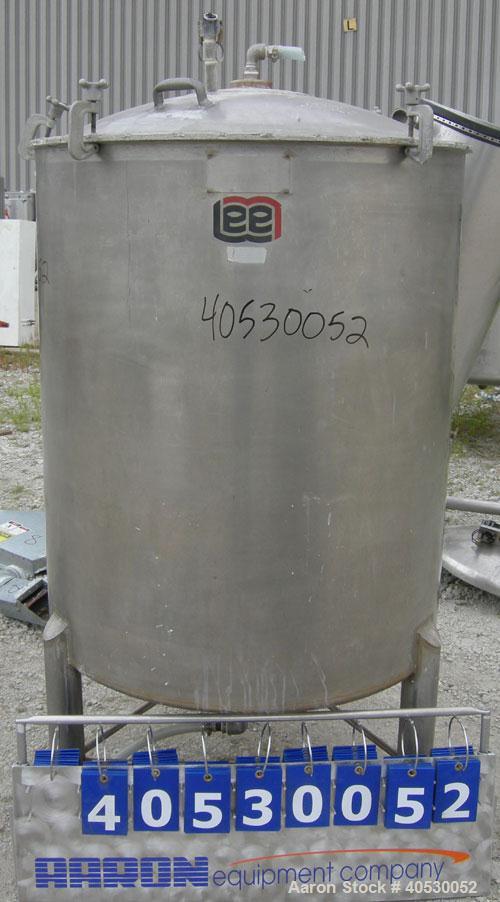 Used - Lee Metal Products Tank, Model 200DBT, 304 stainless steel, vertical. Approximately 40" diameter x 48" straight side, clamp down dished top, dish bottom. 1" center bottom outlet. Mounted on 3 ...