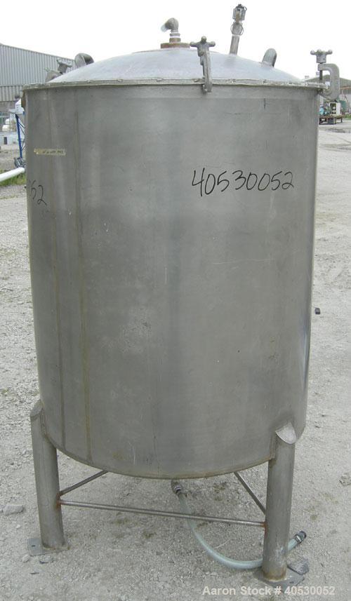 Used - Lee Metal Products Tank, Model 200DBT, 304 stainless steel, vertical. Approximately 40" diameter x 48" straight side, clamp down dished top, dish bottom. 1" center bottom outlet. Mounted on 3 ...