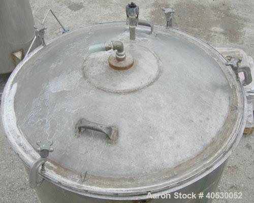 Used - Lee Metal Products Tank, Model 200DBT, 304 stainless steel, vertical. Approximately 40" diameter x 48" straight side, clamp down dished top, dish bottom. 1" center bottom outlet. Mounted on 3 ...