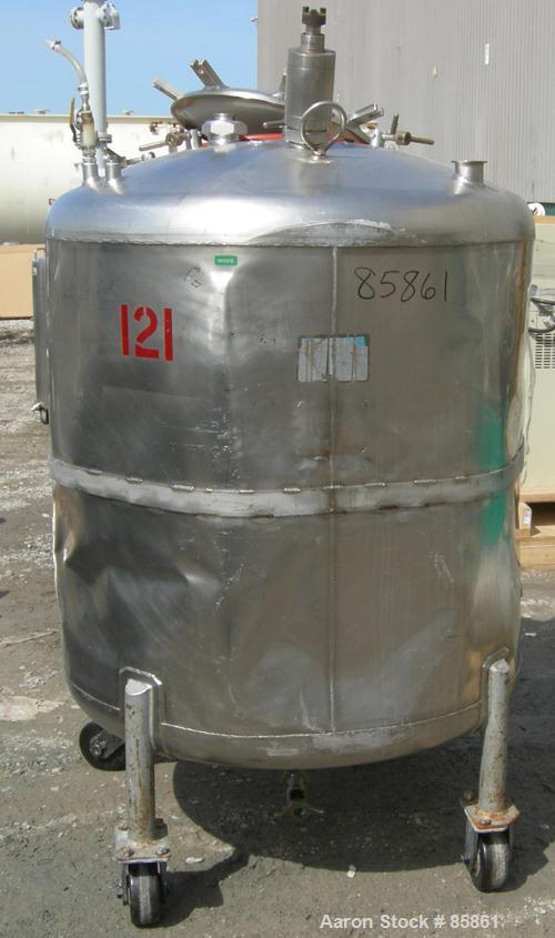 USED: Mueller tank, 300 gallon, 304 stainless steel, vertical. 44" diameter x 42" straight side, dished top and bottom. 1" diameter bottom supported shaft with (2) 3 blade turbines (no drive). 2 Side...